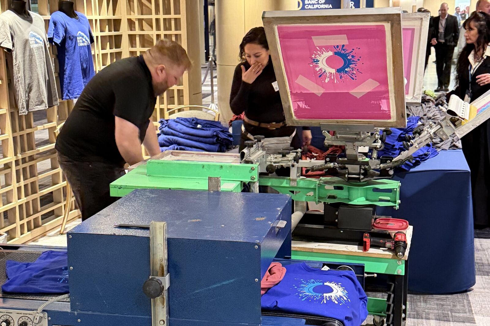 DTF transfers being produced and staged for a live event customization station